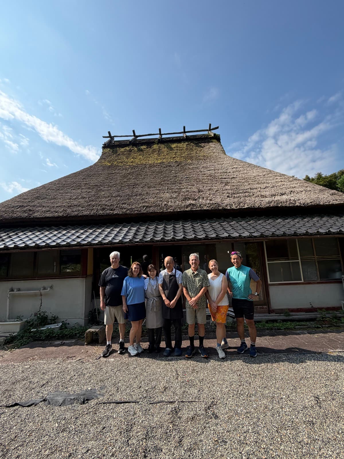 Tour group at a thatched-roof house in Miyama, Kyoto