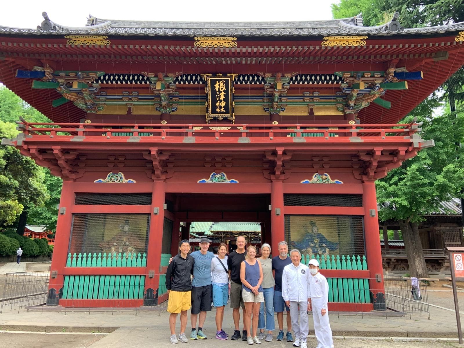 Tour group at the gate of Nezu Shrine